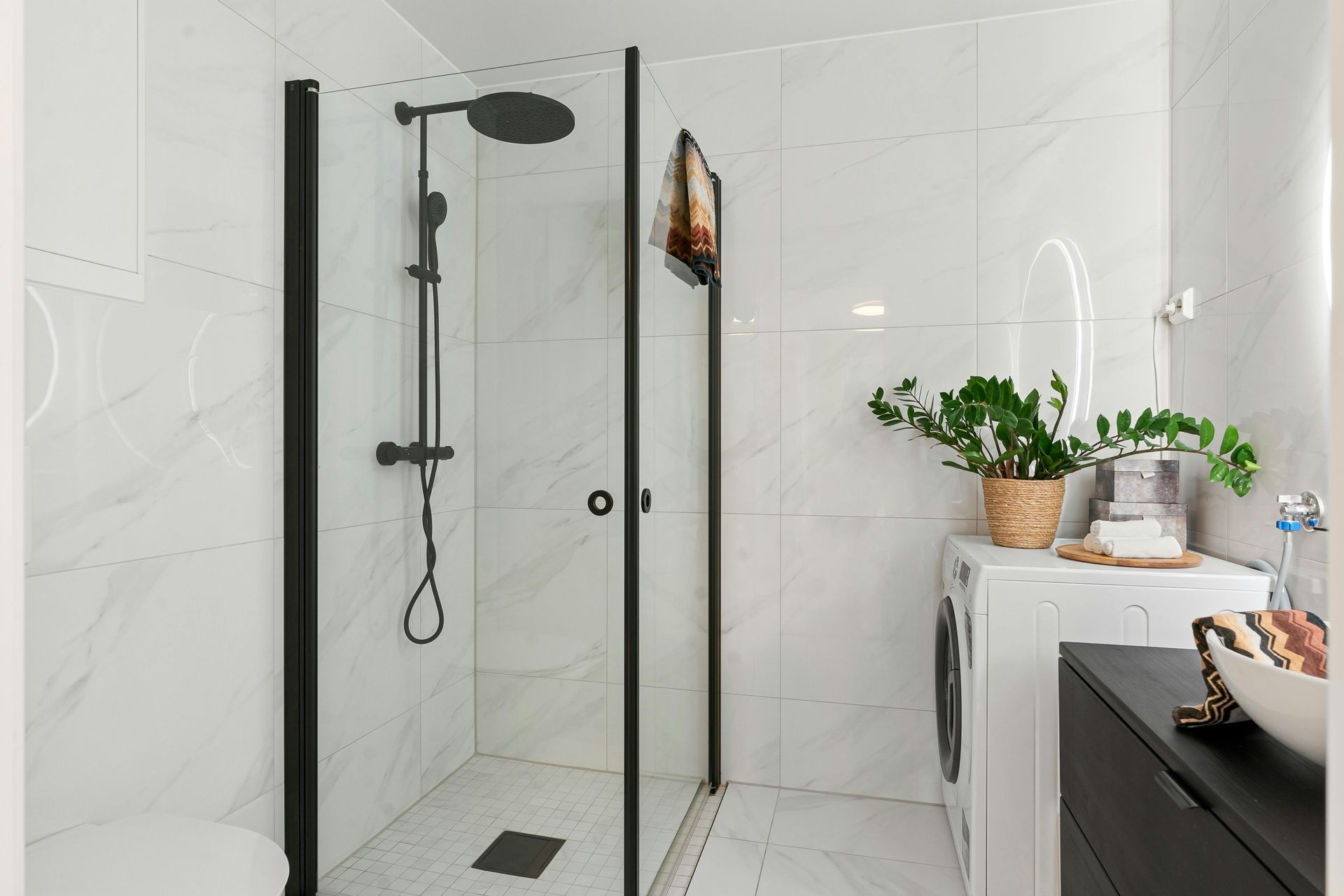 A Bathroom With a Walk in Shower and a Washing Machine — FNQ Hot Water In Mareeba, QLD