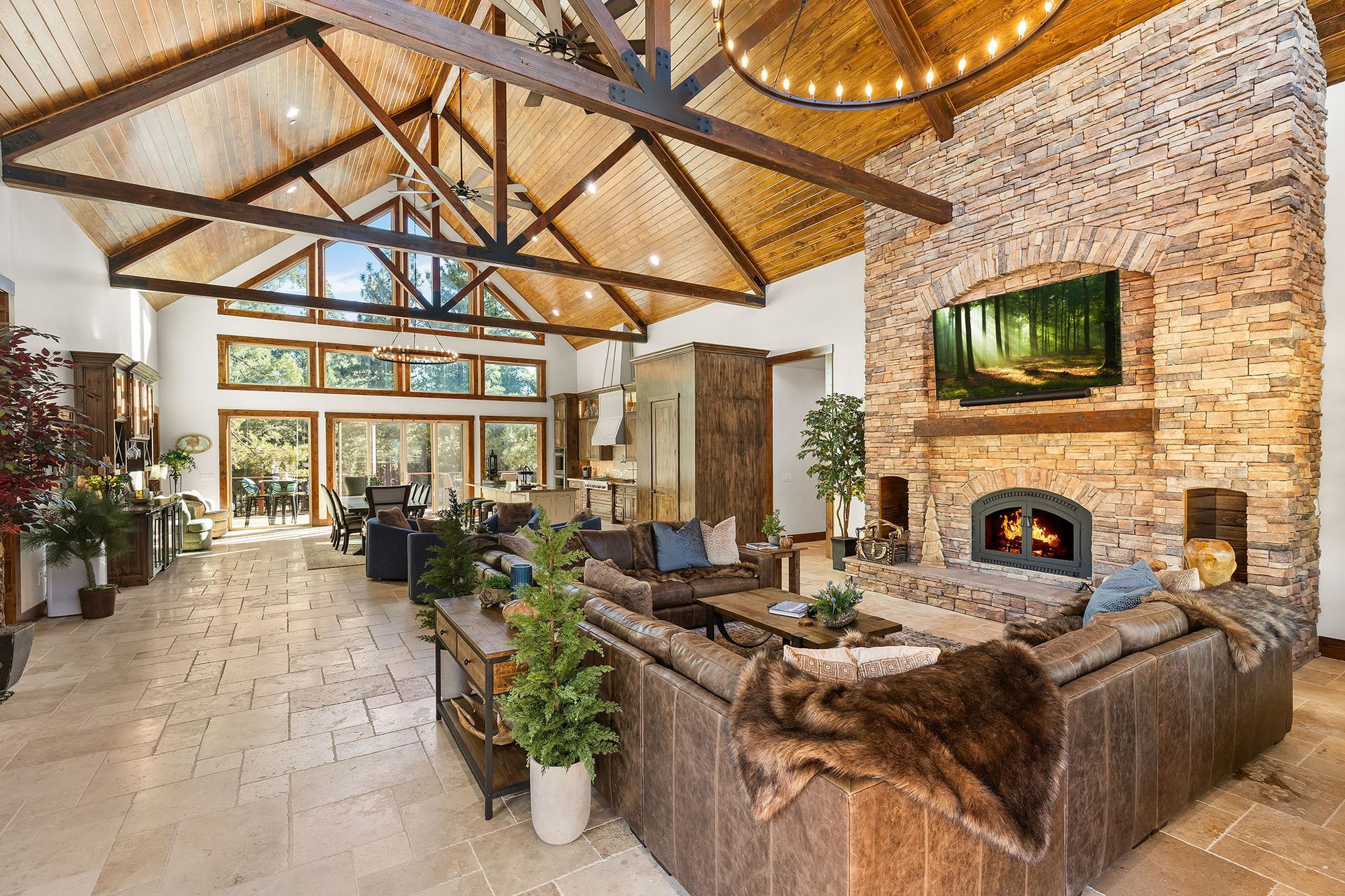 A living room with a fireplace , couch , and television.