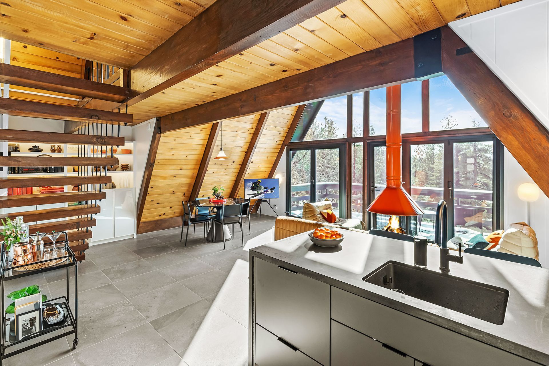 A kitchen with a sink and a fireplace in it