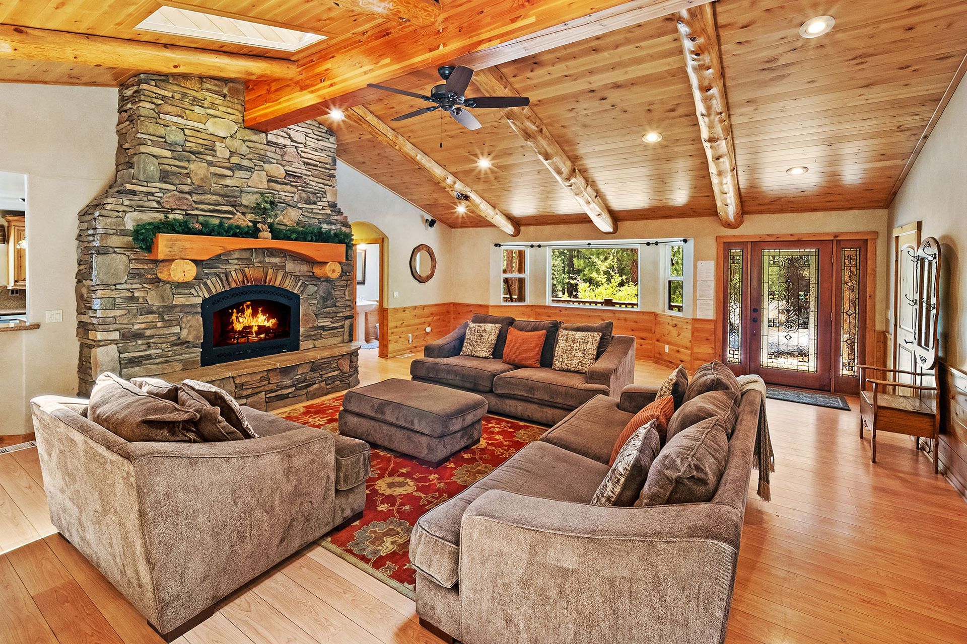 A living room with two couches and a fireplace