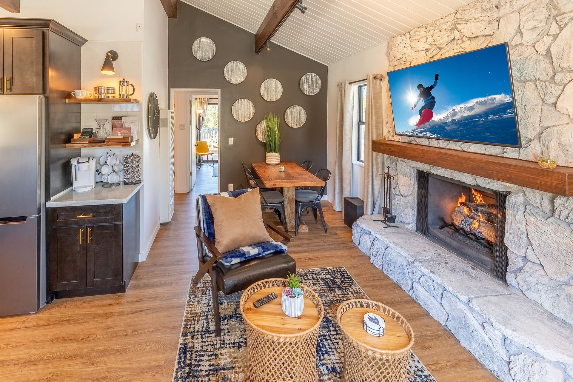 A living room with a fireplace and a flat screen tv.