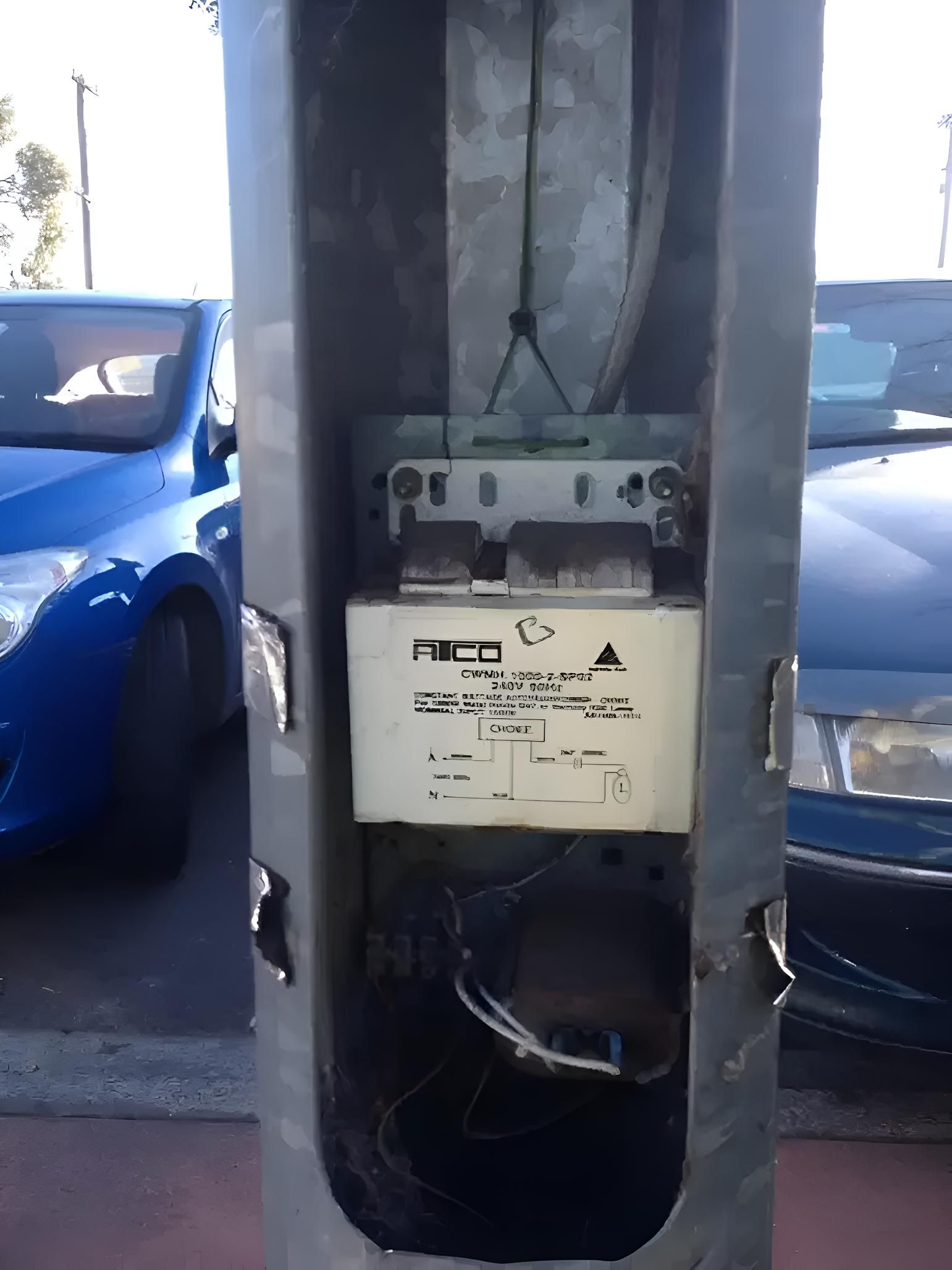 A Blue Car Is Parked Next To A White Box That Says Pico — Keany's Electrical Service In North Nowra, NSW