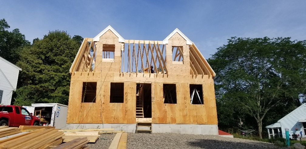 A house that is being built with a lot of plywood