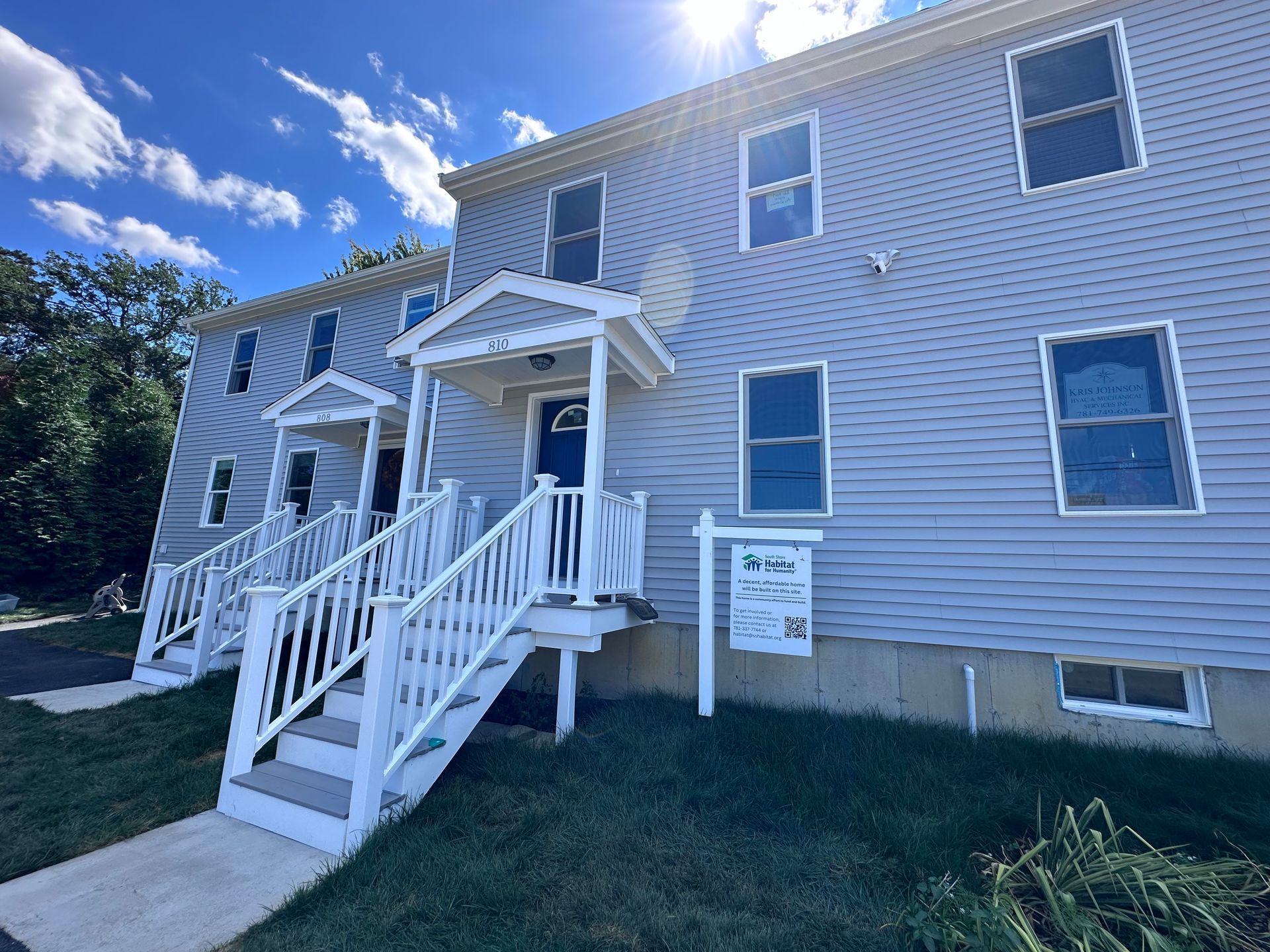 Two homes with white porches.