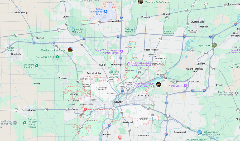 Pastel-colored city map with roads, neighborhoods, and route markers centered on downtown.
