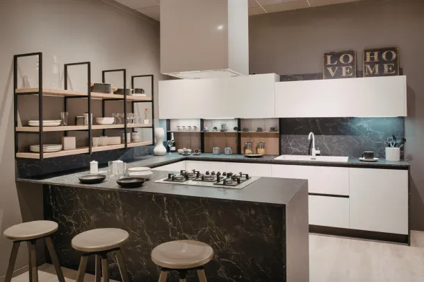 Modern kitchen with black island, bar stools, white cabinets, and open shelving