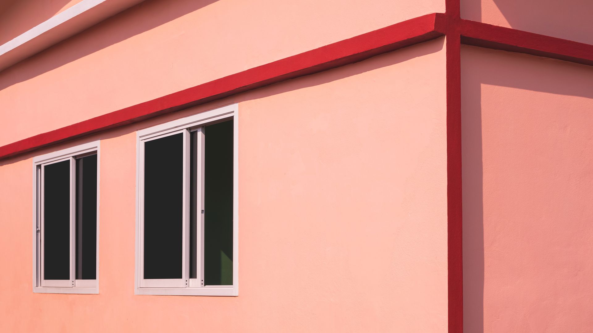 A house with pink walls and two tinted windows — Diamond Tints In Goulburn, ACT