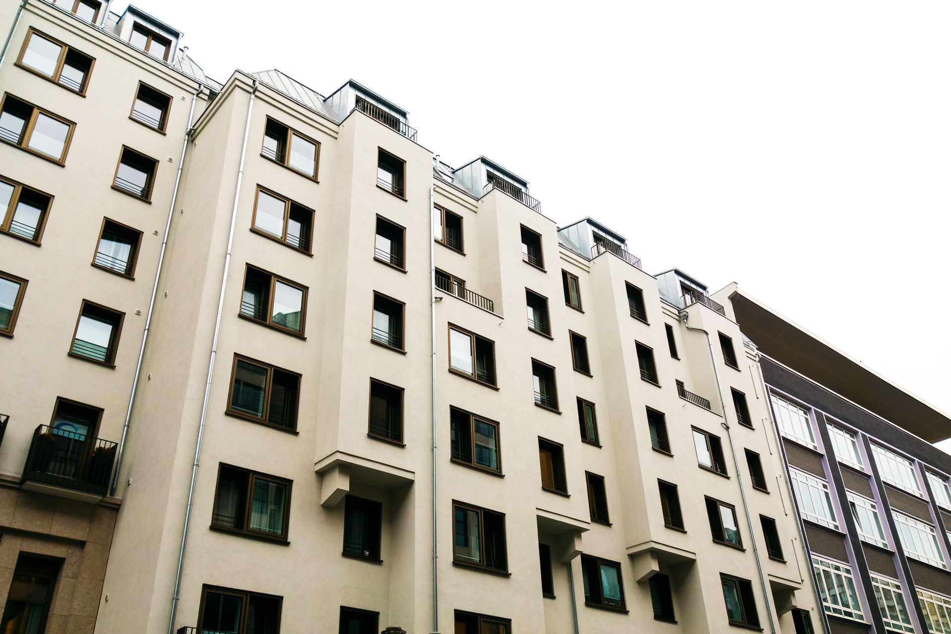 A Tall Building With a Lot of Windows and Balconies — Diamond Tints In Bungendore, ACT
