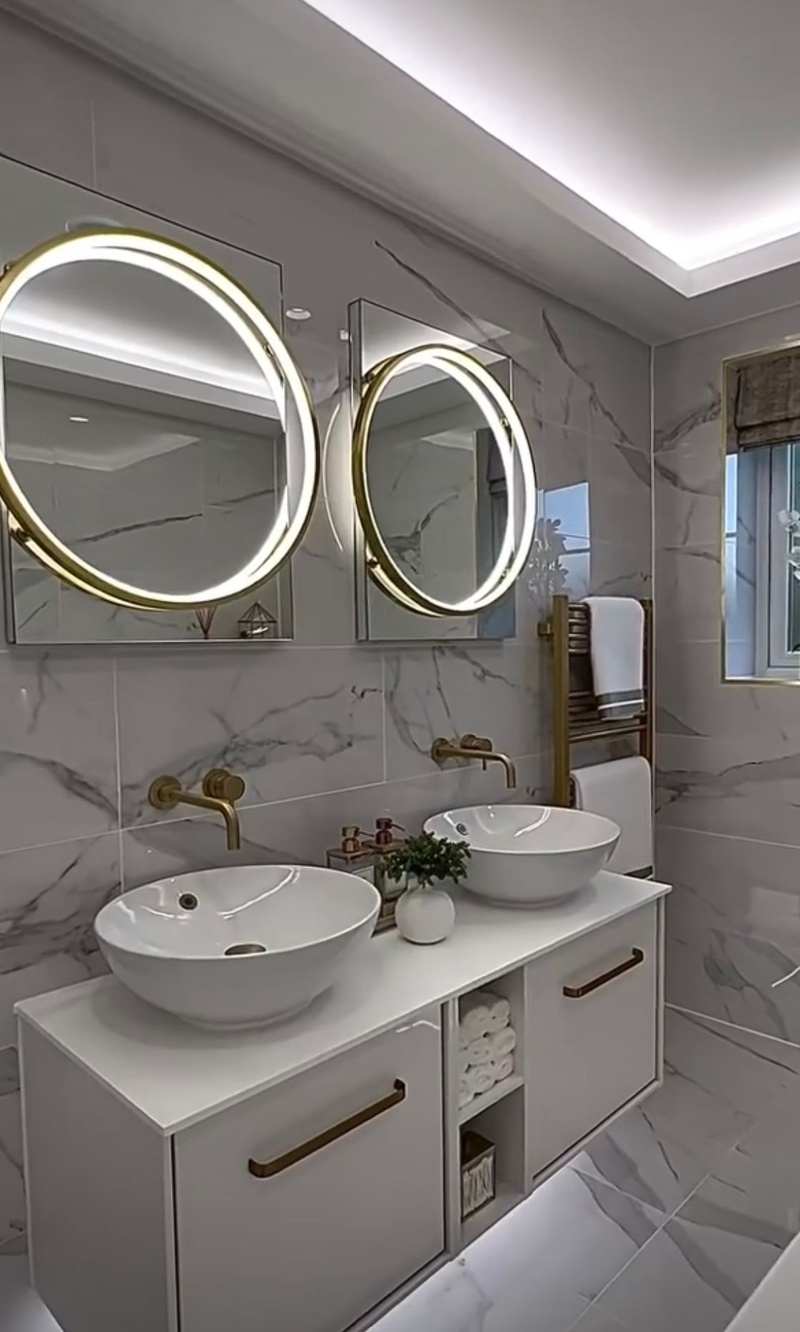 A bathroom with two sinks and two mirrors.