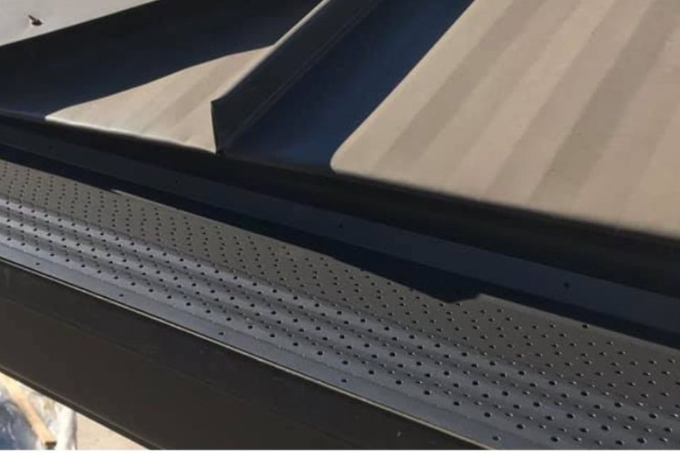 White color metal rain roof gutter with holes