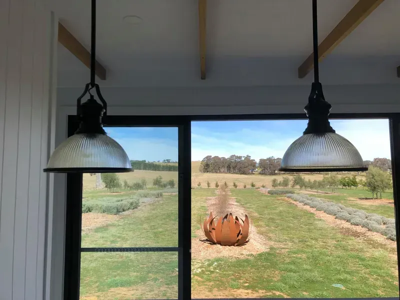 Rustic Metal Sculpture in a Green Field, Framed — Technik Electrical in Renwick, NSW