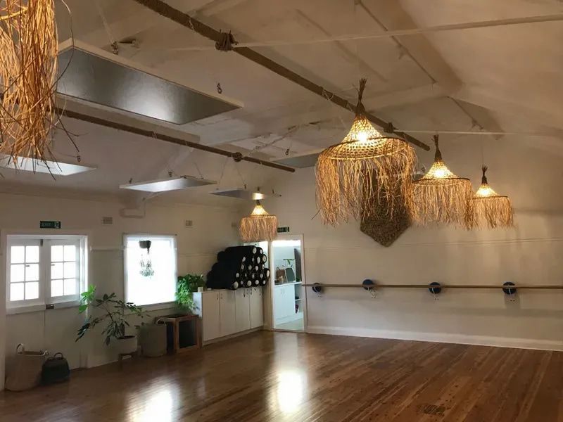 A Yoga Studio With Hardwood Floors, a Ballet Barre, and Straw-fringed Pendant Lights — Technik Electrical in Renwick, NSW