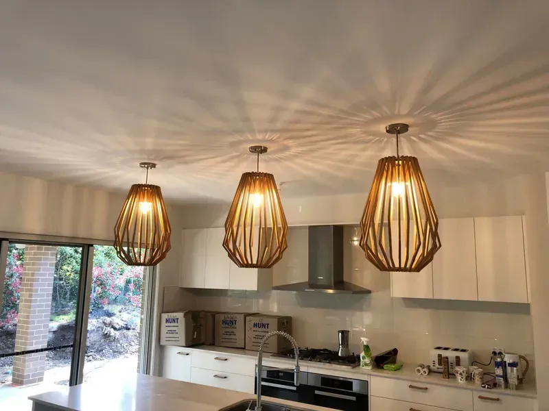 Modern Kitchen With Three Woven Pendant Lights — Technik Electrical in Renwick, NSW