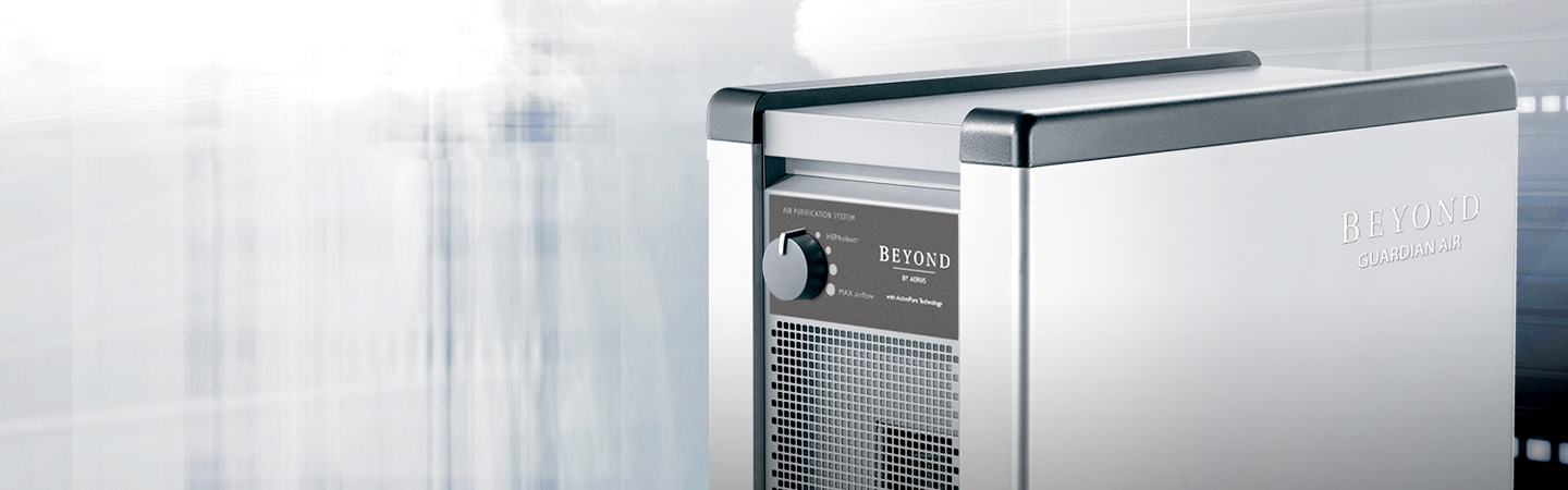 A close-up of a stainless steel professional kitchen blast chiller on a bright, abstract background.