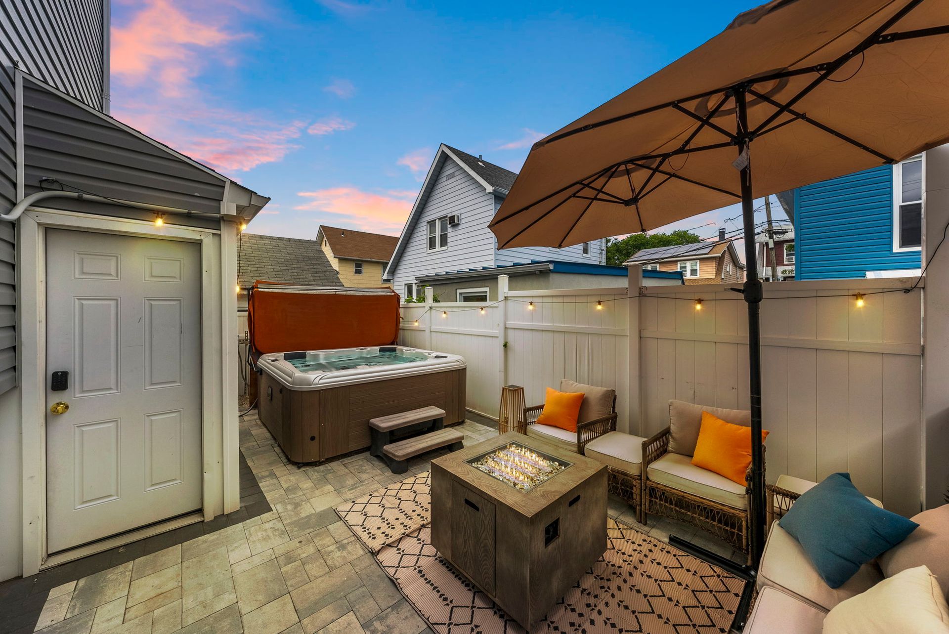 Outdoor patio with private hot tub at Escape From Manhattan in North Bergen NJ