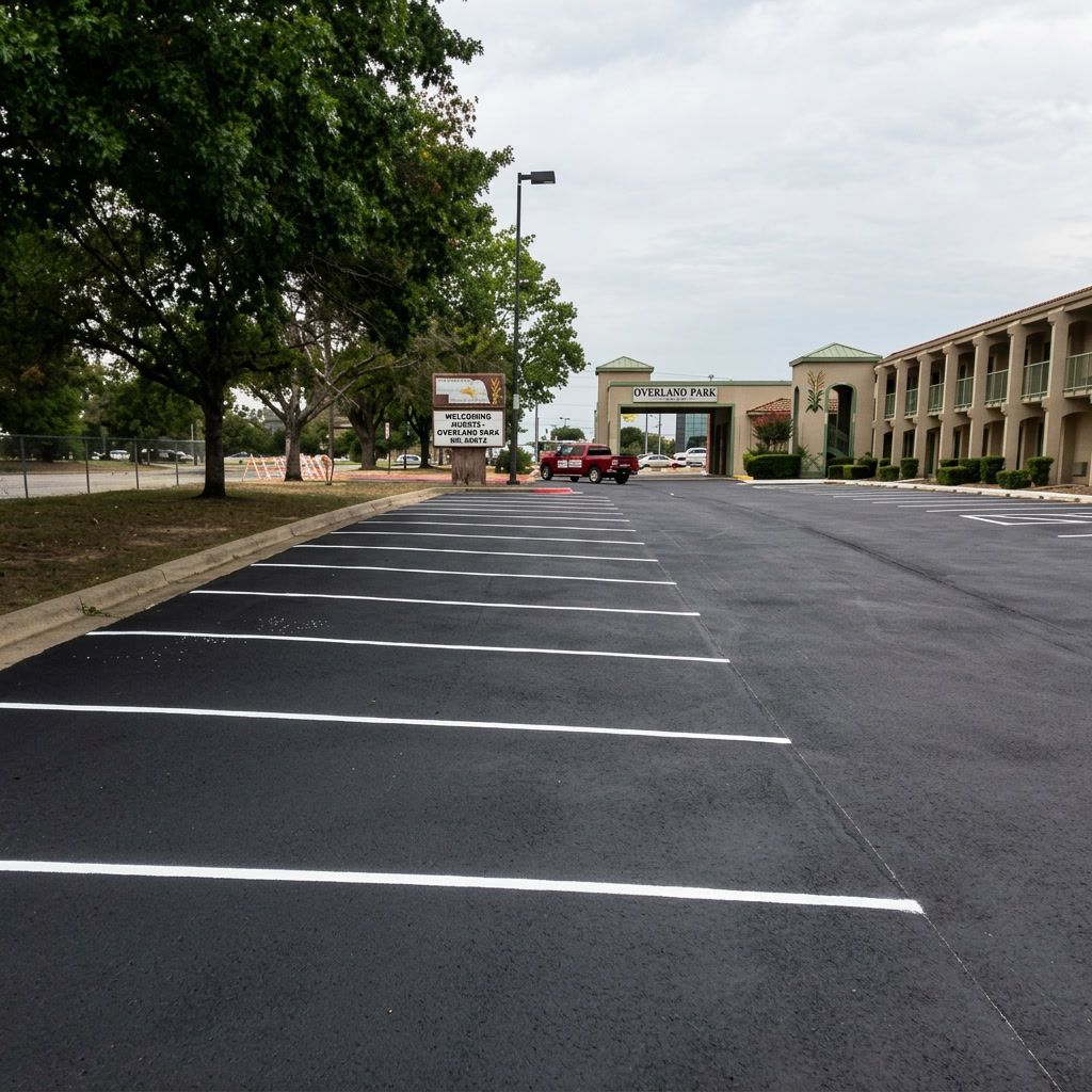 Fresh asphalt sealcoating in Overland Park, KS with smooth black pavement and clean parking lot striping.