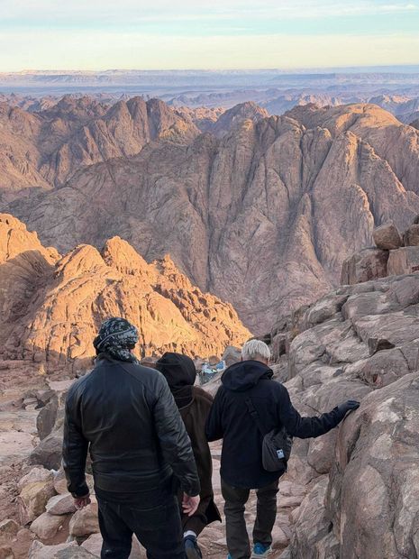 Ancient cliffside buildings built into a rocky desert canyon