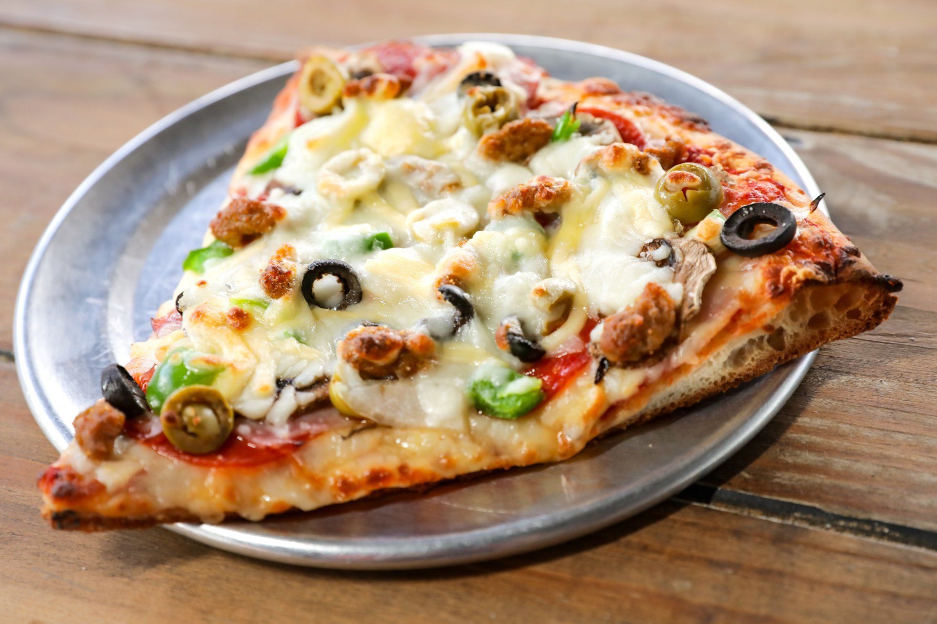 Slice of ultimate pizza — Macon, GA — Ingelside Village Pizza