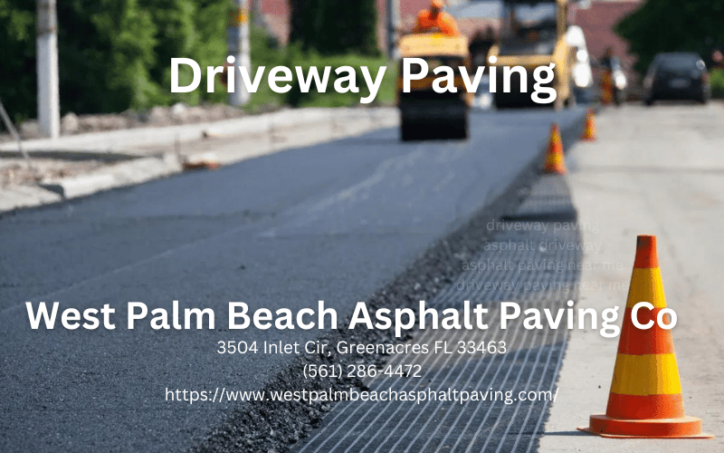 worker leveling fresh asphalt on a road construction