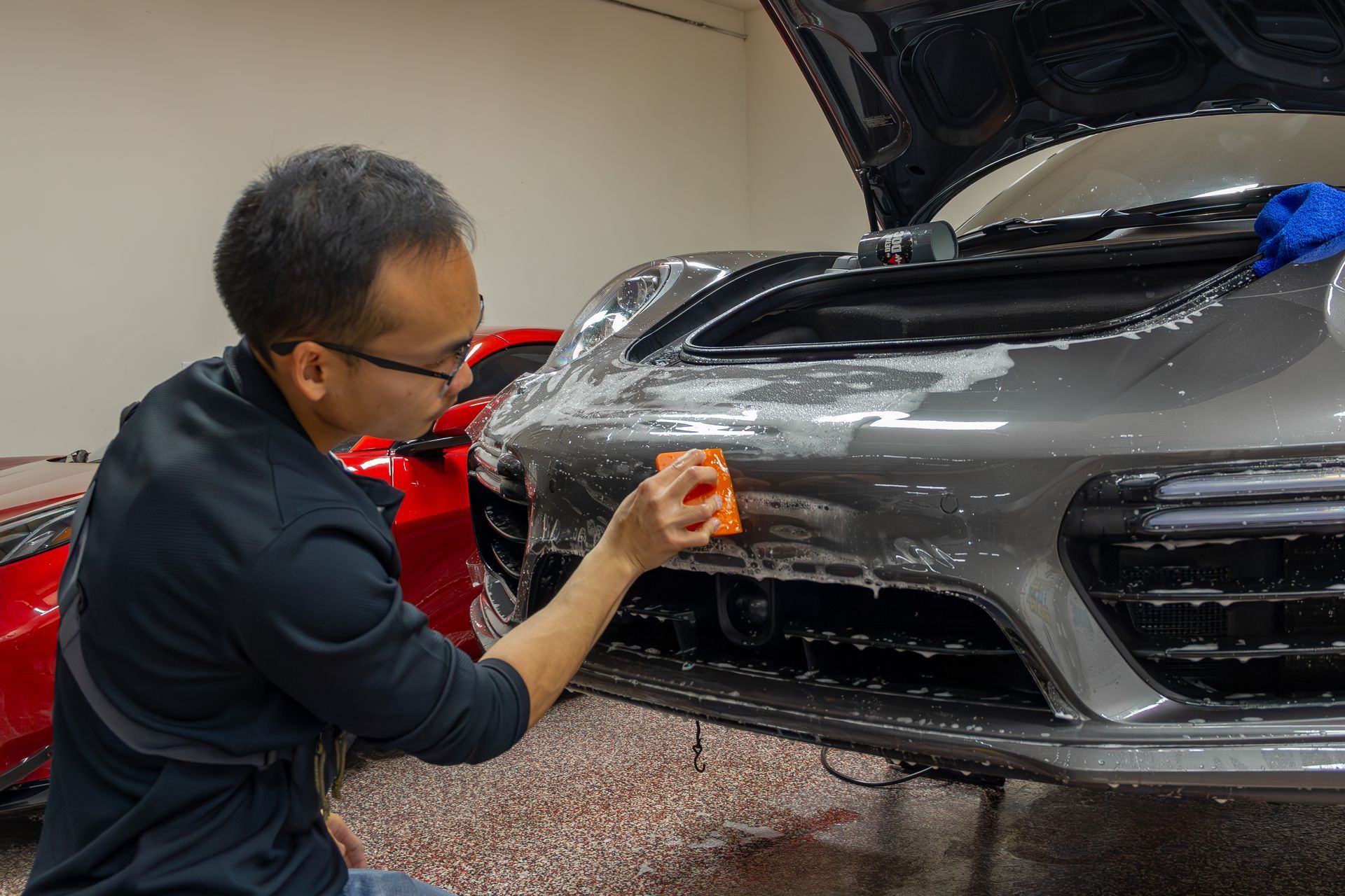 mclaren green sports car getting paint protection film