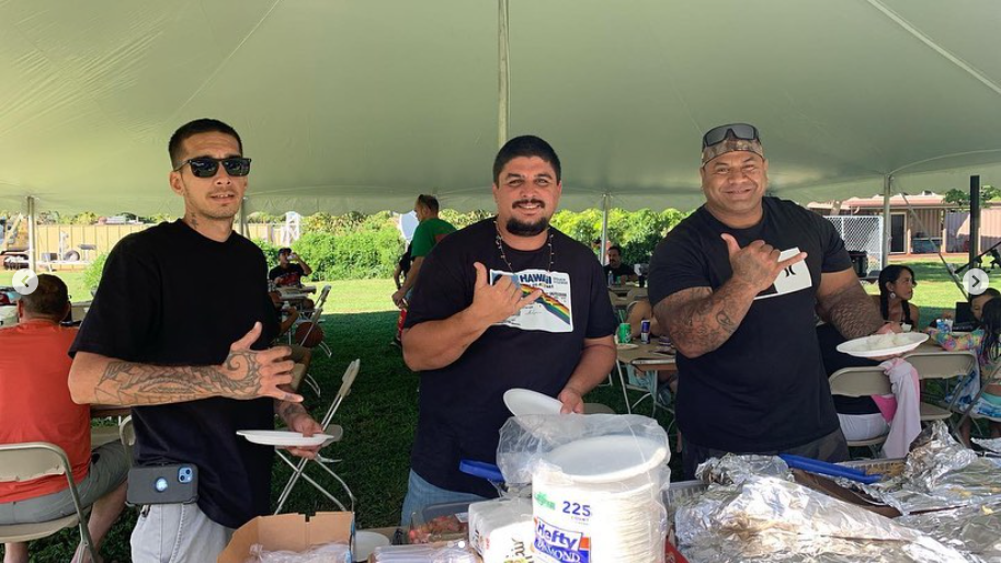 Three Men Holding Plate - Puunene, HI - Island Commercial Doors & Windows, LLC