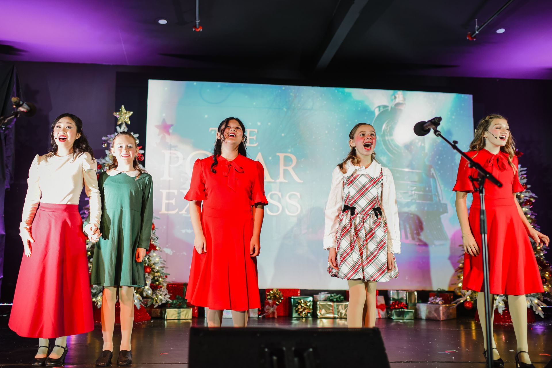 Children's Musical Theatre South Bay California Kids Theater singers on stage in dresses performing.