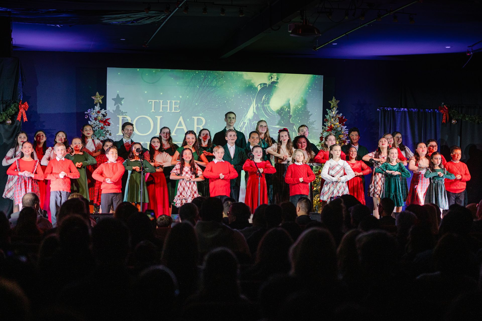 Children's Musical Theatre South Bay California Kids Theater Choir performing onstage under colorful lights audience