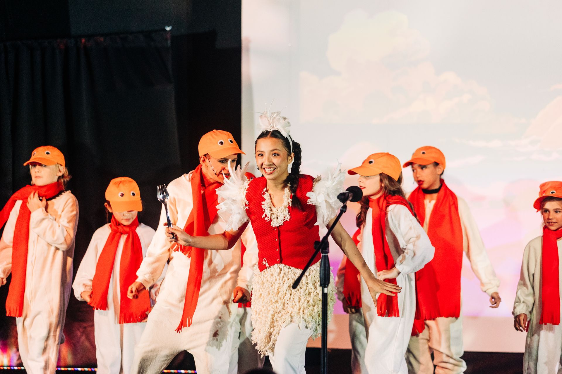 Youth theater performers in seagul costumes during a Little Mermaid stage production at Revolution Theatre Company.
