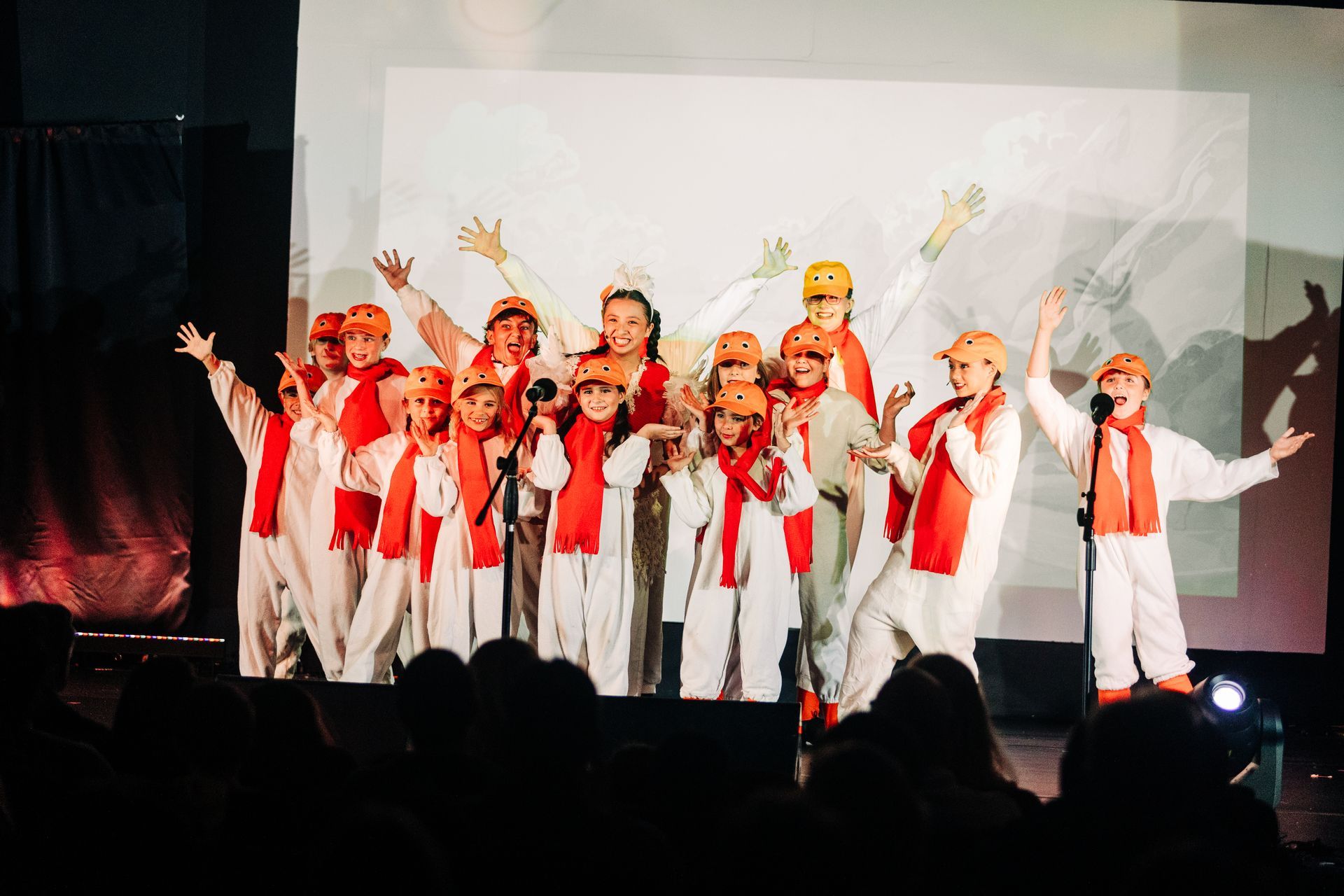 Youth theater performers in seagul costumes during a Little Mermaid stage production at Revolution Theatre Company.