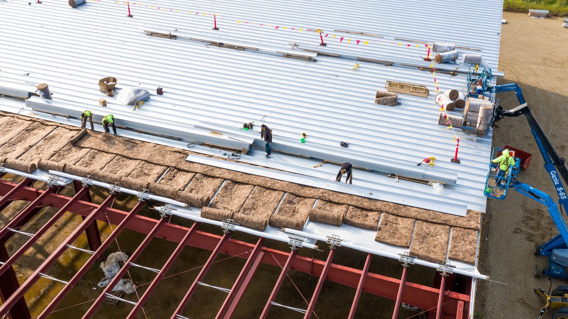 men working on a commercial roof