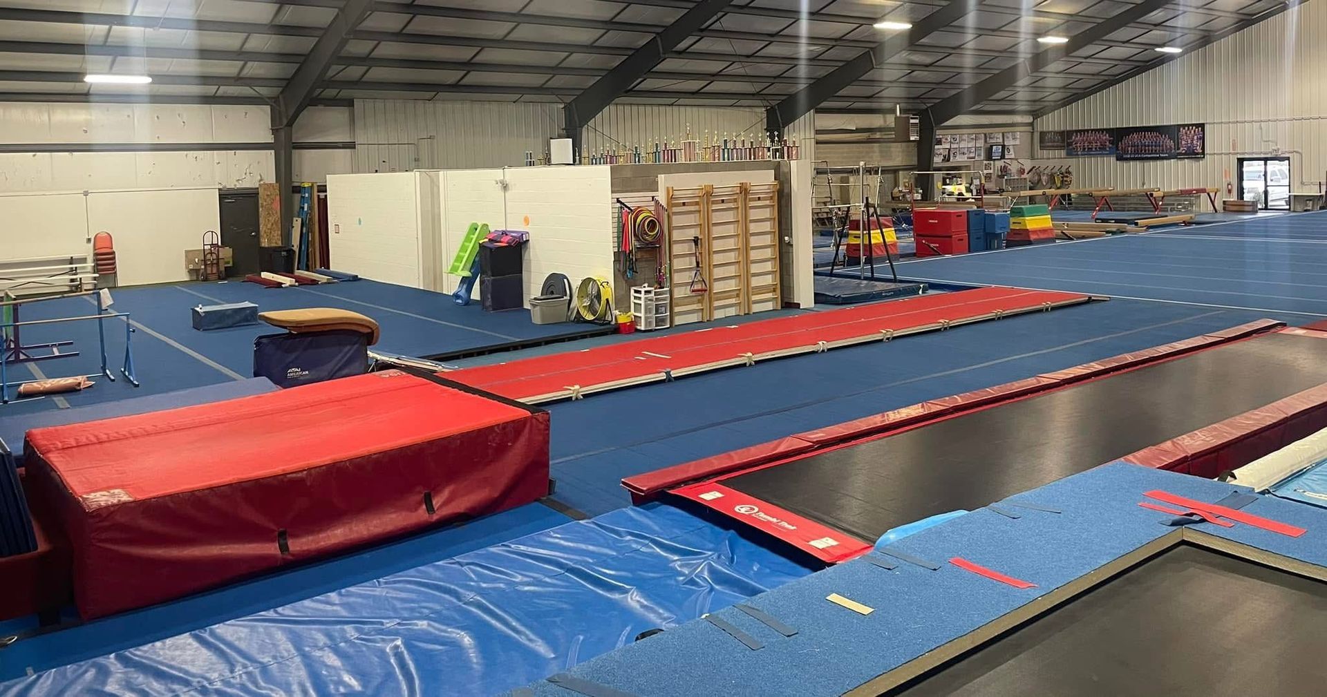 There are a lot of trampolines in this gym.