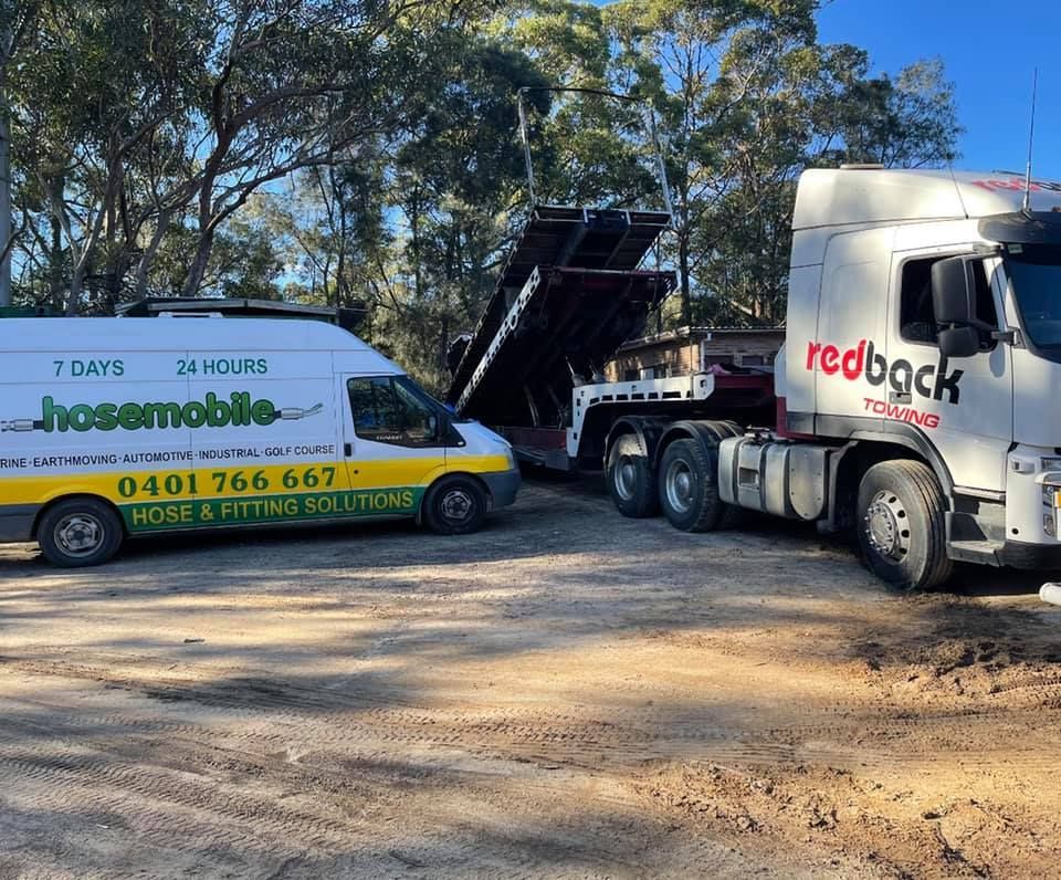 A Hosemobile Van Is Parked Next To A Redback Truck — Hosemobile In Kariong, NSW