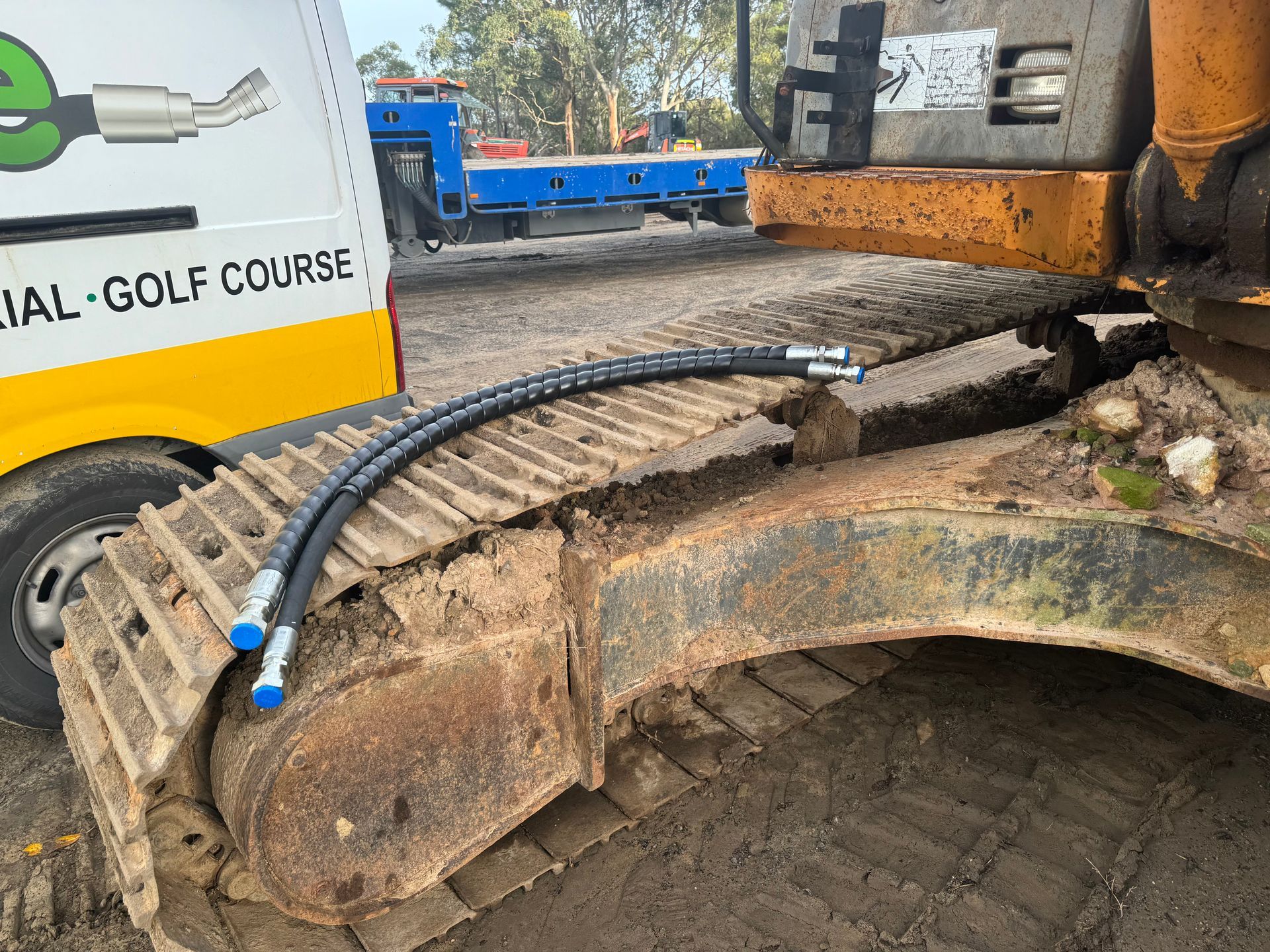 A close up of a bulldozer with hydraulic hoses attached to it. — Hosemobile In Kariong, NSW