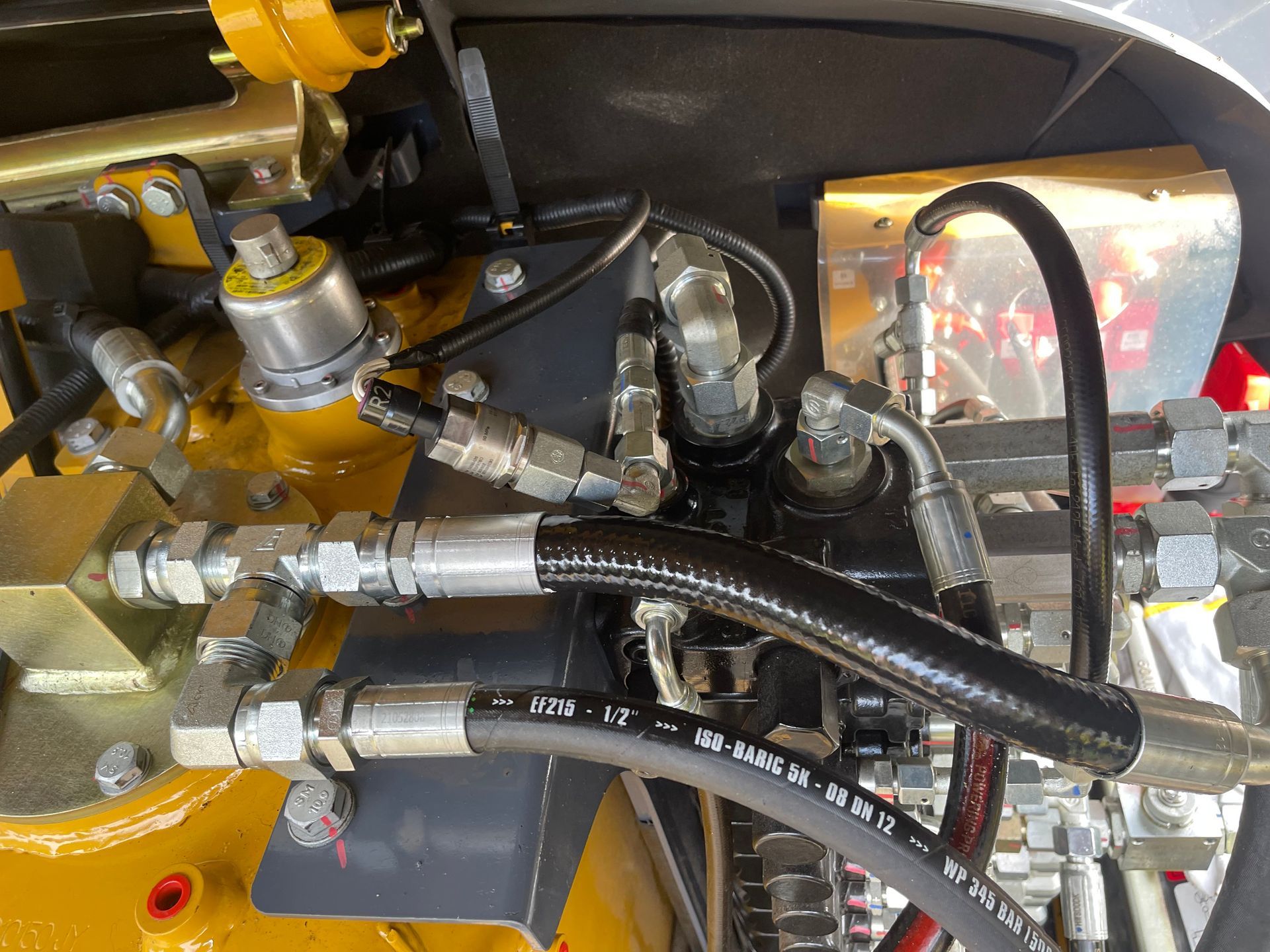 A Close Up Of Hydraulic Hoses On A Machine — Hosemobile In Way Way, NSW