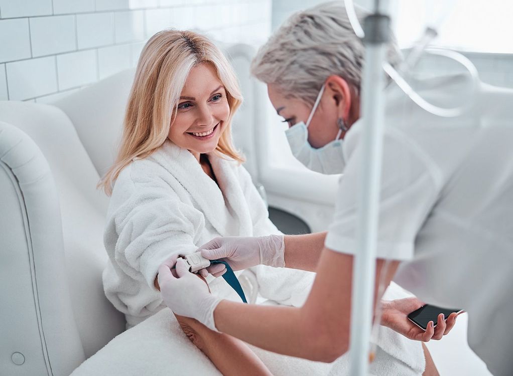 Nurse taking a patient’s blood pressure in a bright clinic room