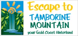 Logo reading “Escape to Tamborine Mountain” with blue waterfall and green forest, “your Gold Coast Hinterland” tagline