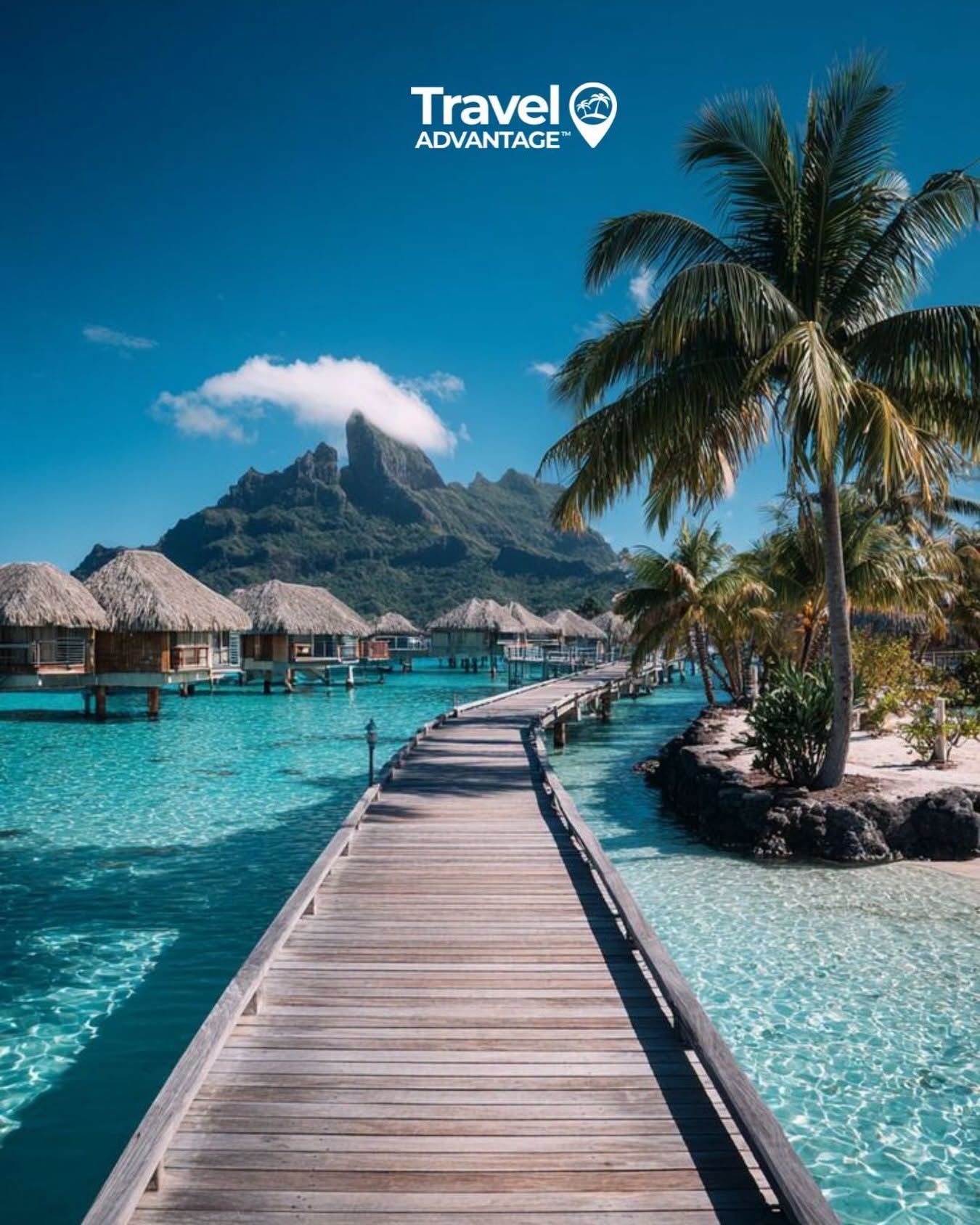 Tropical resort boardwalk over turquoise water with palm trees and overwater bungalows