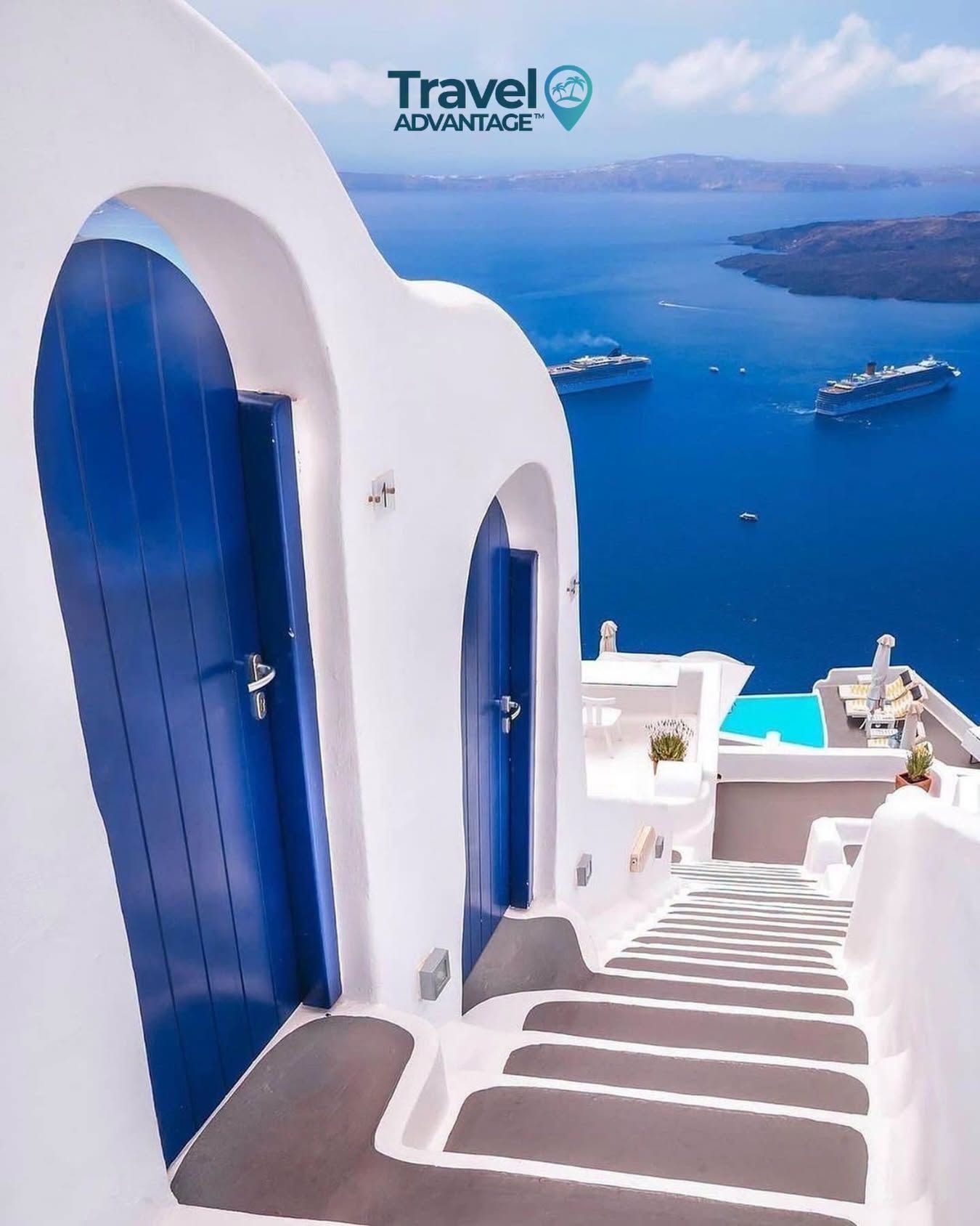 White cliffside stairs with blue doors overlooking a bright blue sea and distant islands.