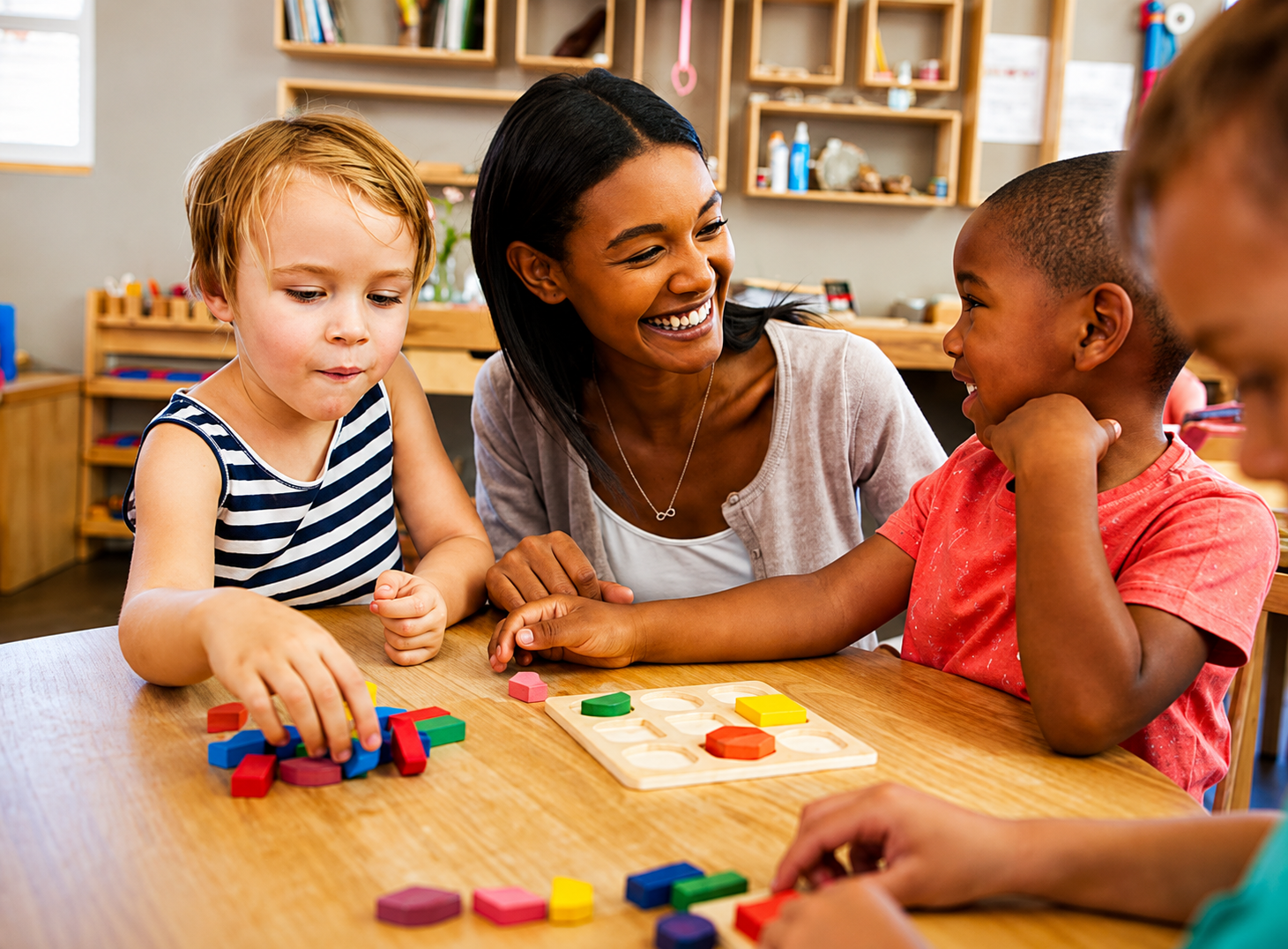 Preschool children participating in a Spanish immersion learning activity with their teacher at Kids