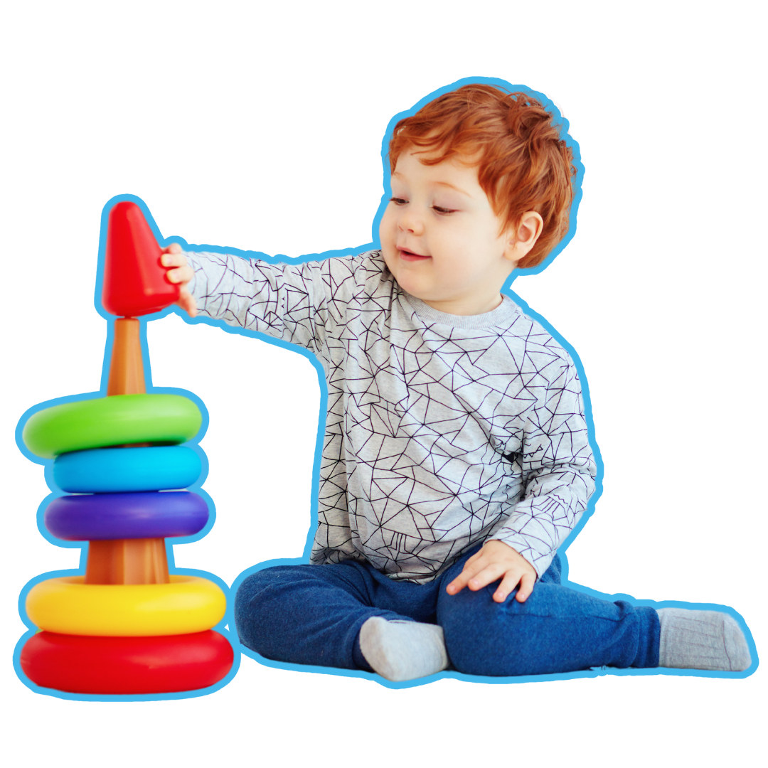 A baby is sitting on the floor playing with a stacking toy