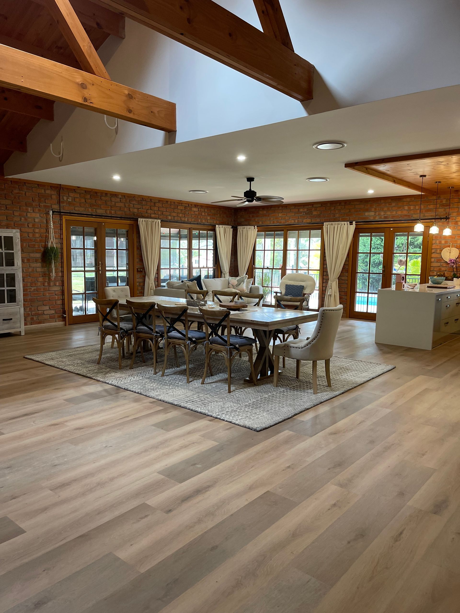 A large room with a dining table and chairs in it.