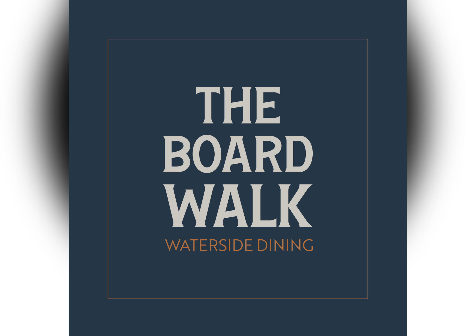 The Board Walk restaurant logo on a dark blue square with gold border and text, “Waterside Dining”