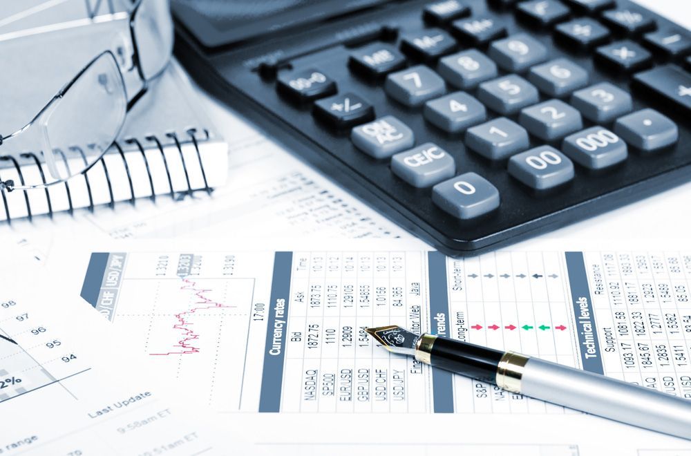 A Pen Is Sitting on A Piece of Paper Next to A Calculator — Adding Value CFO Pty Ltd in Larrakeyah, NT