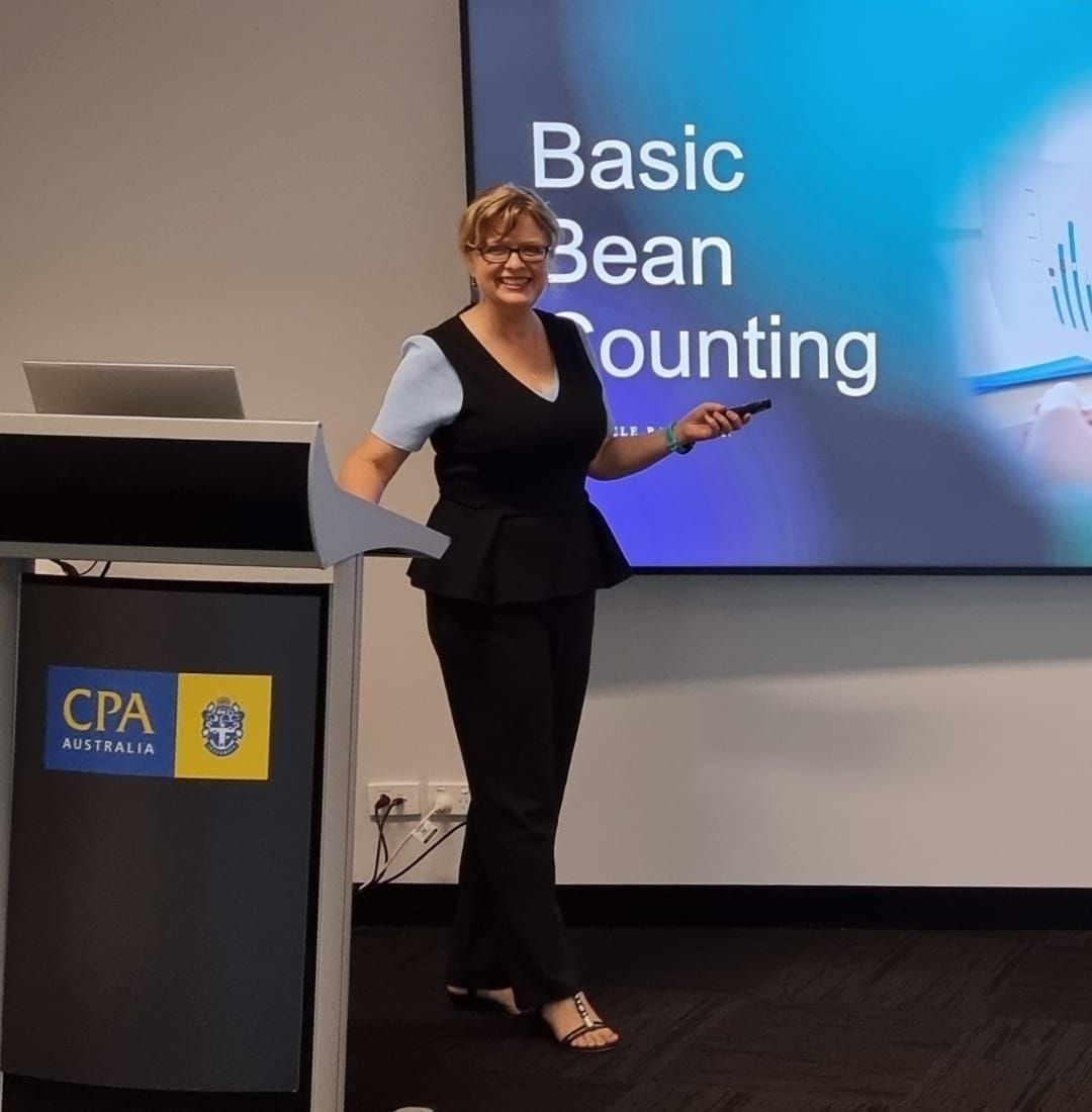 A Woman Presenting Basic Bean Counting on a Screen — Adding Value CFO Pty Ltd in Larrakeyah, NT