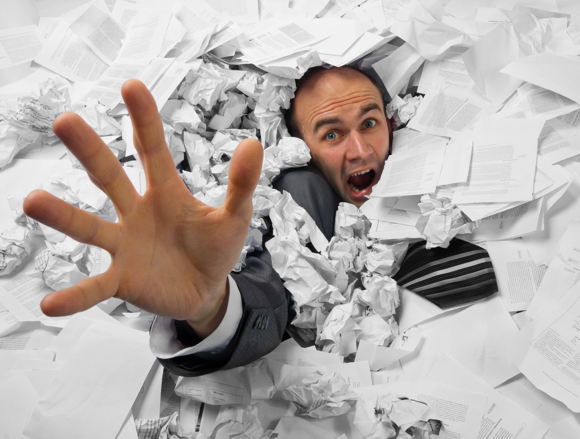 A Woman Is Sitting at A Desk Writing Notes — Adding Value CFO Pty Ltd in Larrakeyah, NT