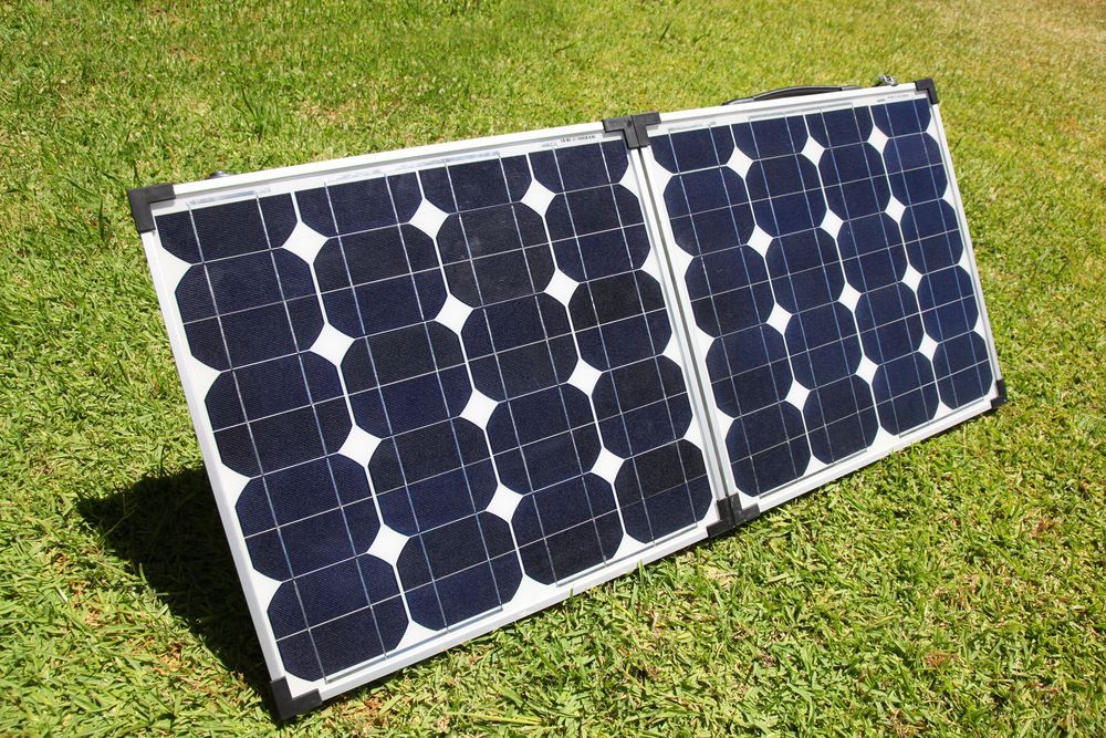 Two Solar Panels Lying on Grass in Bright Sunlight — Enterprise Air That's Cool In Svensson Heights, QLD