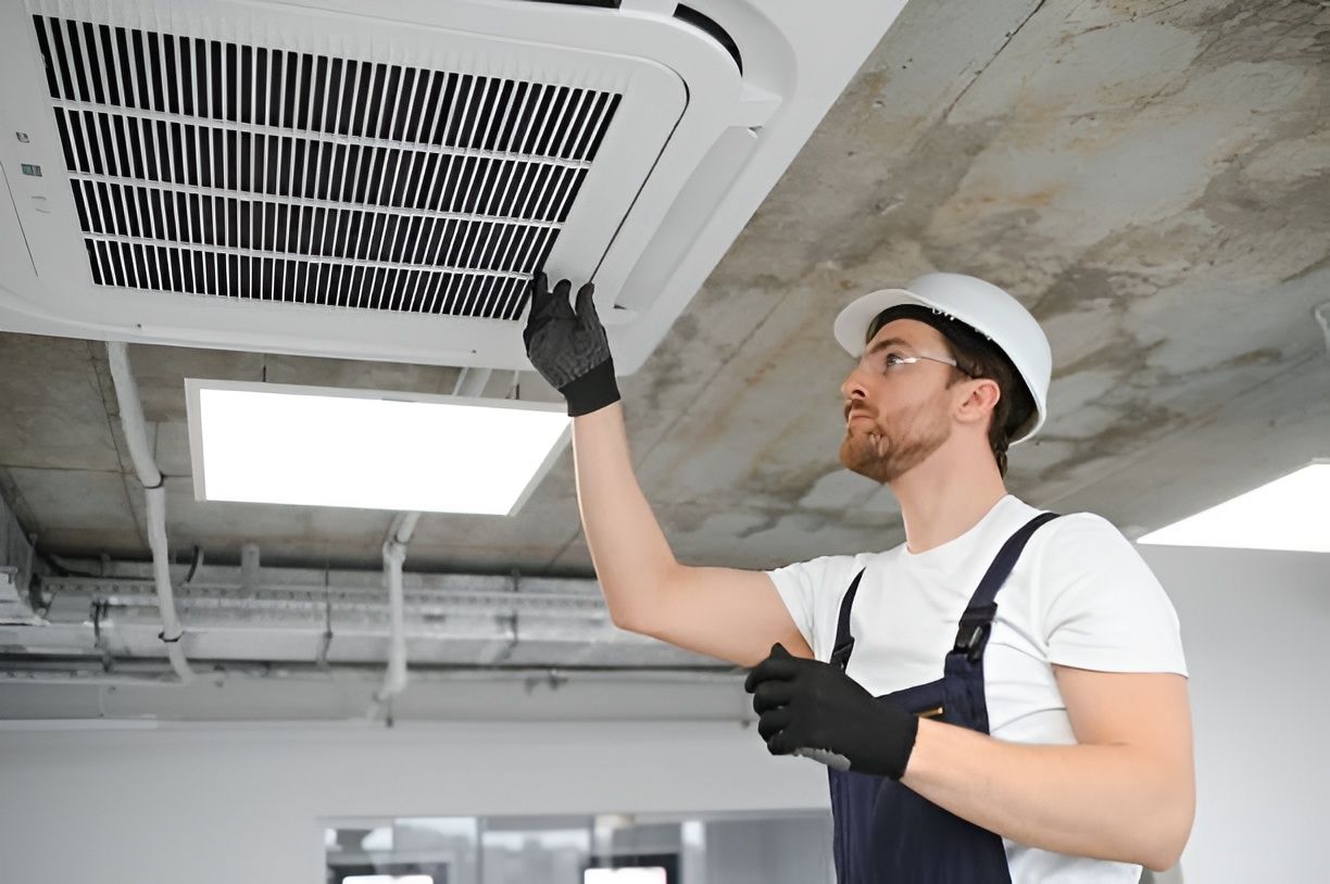 Technician Inspecting a Ceiling Air Vent — Enterprise Air That's Cool In Woodgate, QLD