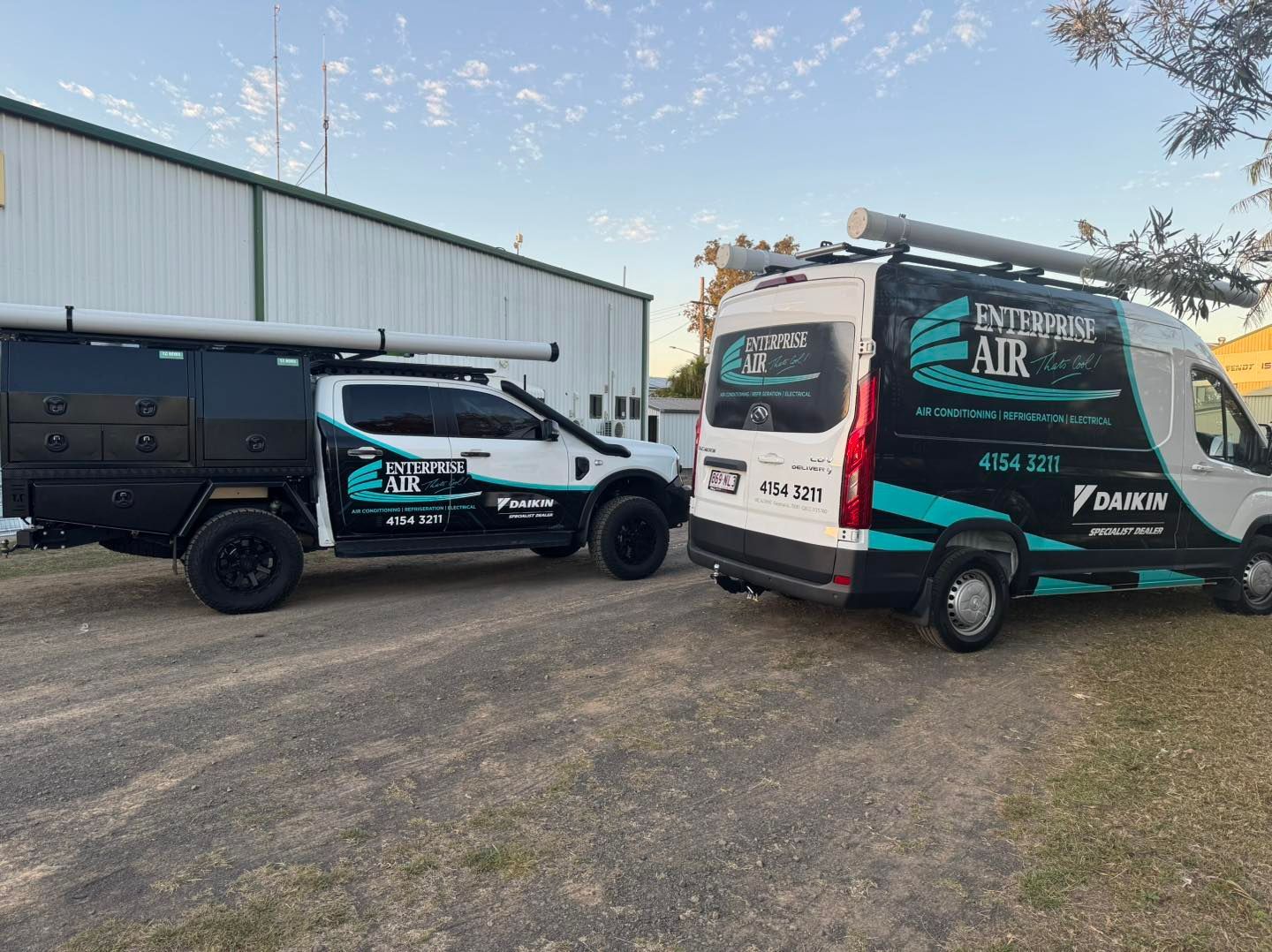 Two Branded Service Vans Parked on Gravel — Enterprise Air That's Cool In Svensson Heights, QLD