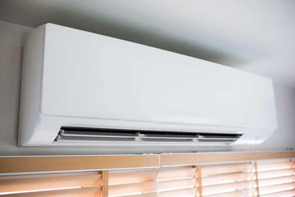 White Wall-mounted Air Conditioner — Enterprise Air That's Cool In Svensson Heights, QLD