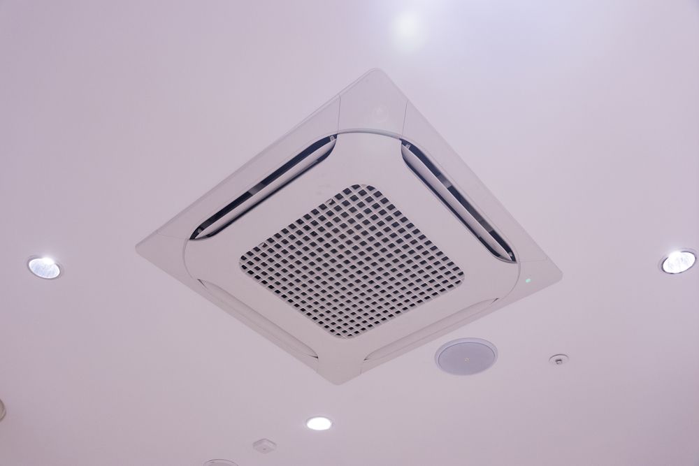 Ceiling-mounted Air Conditioner Vent in a White Room — Enterprise Air That's Cool In Svensson Heights, QLD